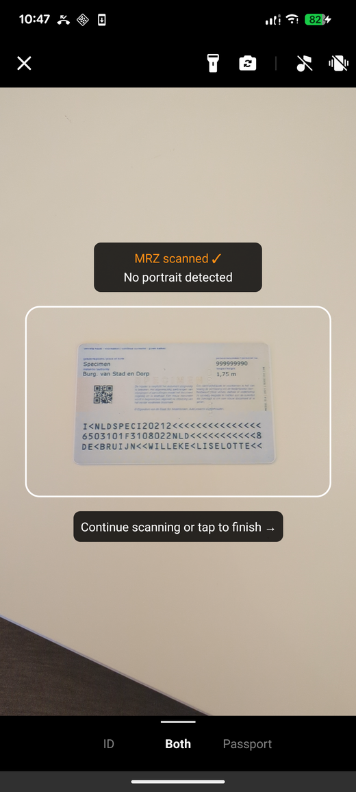 The scanner reporting no portrait detected, with a prompt to continue scanning or tap to finish